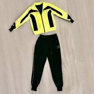 Оптом дитячий спортивний костюм 2-х нитка для дівчинки м.7/3 1уп. 4шт р116/122/128/134 жовтий в асортименті - фото 1
